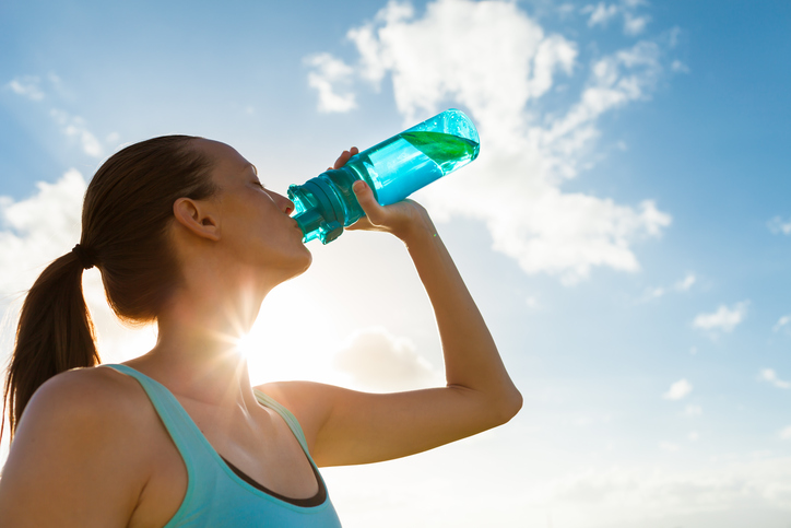 woman drinking water bottle