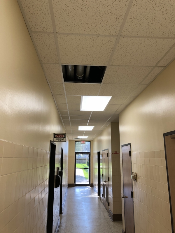 A conduit installed in the new maintenance building and the ceiling that covers it.