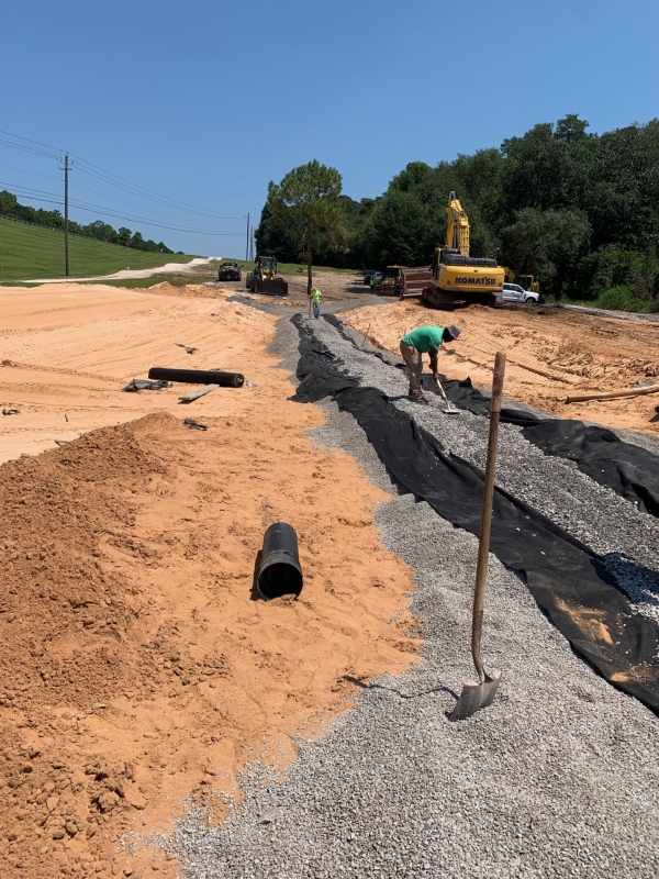 Installation of pipe drain from the toe berm as well as the building of the filter drain.