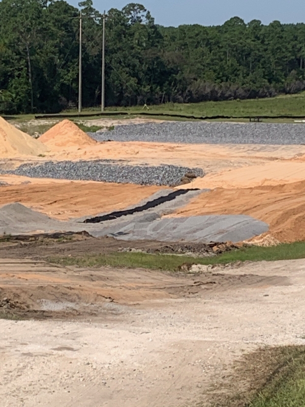 Installation of pipe drain from the toe berm as well as the building of the filter drain.